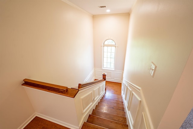 22 Jacob Pl, Little Rock, AR 72211 - stairs featuring a decorative wall, wood finished floors, ornamental molding, and wainscoting