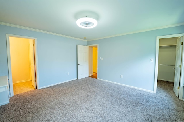 22 Jacob Pl, Little Rock, AR 72211 - unfurnished bedroom featuring crown molding, carpet floors, a spacious closet, ensuite bathroom, and a closet