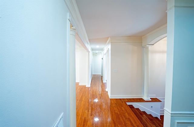 22 Jacob Pl, Little Rock, AR 72211 - hall featuring decorative columns, wood finished floors, and ornamental molding