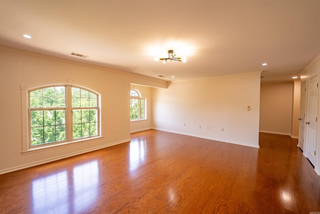 22 Jacob Pl, Little Rock, AR 72211 - unfurnished room with crown molding, wood finished floors, recessed lighting, and a chandelier