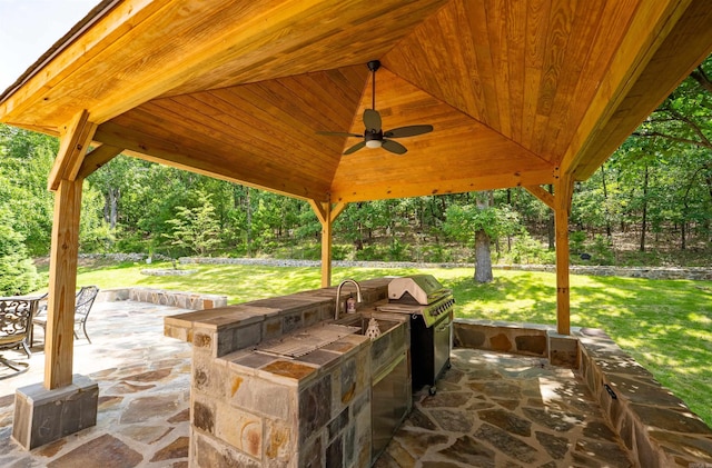 22 Jacob Pl, Little Rock, AR 72211 - view of patio with area for grilling, ceiling fan, and view of scattered trees