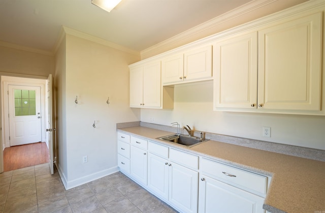 22 Jacob Pl, Little Rock, AR 72211 - kitchen featuring crown molding, light countertops, and light tile patterned floors