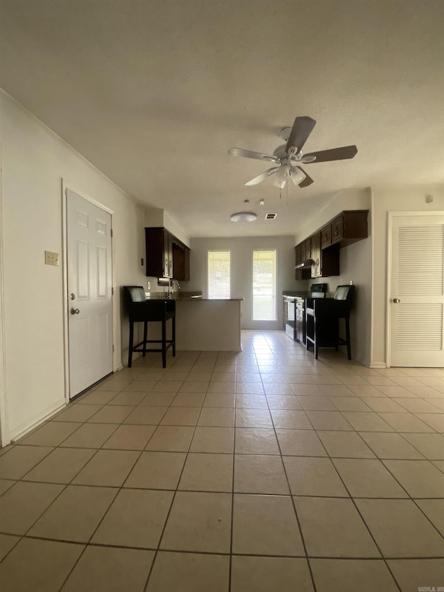 9425 Labette Dr, Little Rock, AR 72205 - living area featuring light tile patterned floors and a ceiling fan