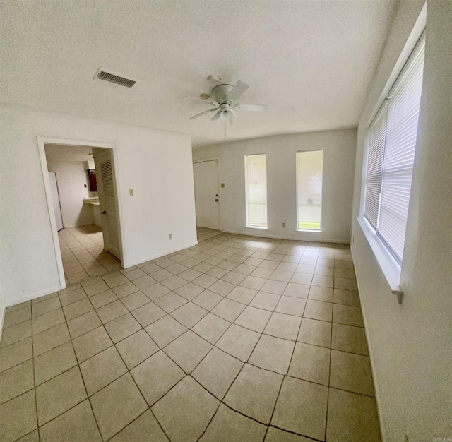 9425 Labette Dr, Little Rock, AR 72205 - empty room with light tile patterned floors and a ceiling fan