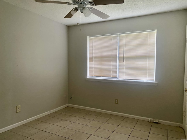 9425 Labette Dr, Little Rock, AR 72205 - unfurnished room featuring light tile patterned floors, a ceiling fan, plenty of natural light, and a textured ceiling