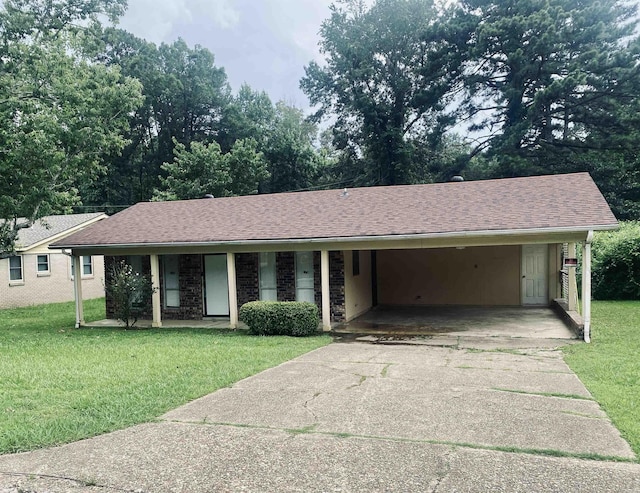 9425 Labette Dr, Little Rock, AR 72205 - ranch-style home featuring concrete driveway, a front yard, an attached carport, a shingled roof, and covered porch