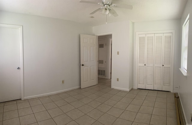 9425 Labette Dr, Little Rock, AR 72205 - unfurnished bedroom featuring light tile patterned floors, a closet, and a ceiling fan
