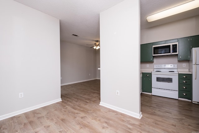 800 N St Unit 48, Little Rock, AR 72201 - kitchen with white appliances, green cabinetry, a ceiling fan, light wood-type flooring, and light countertops