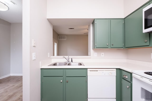 800 N St Unit 48, Little Rock, AR 72201 - kitchen featuring white appliances, light countertops, and light wood-style floors