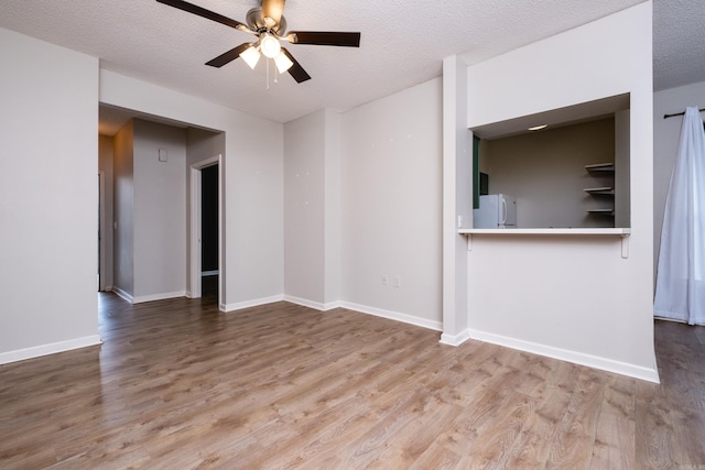 800 N St Unit 48, Little Rock, AR 72201 - unfurnished living room featuring a ceiling fan, wood finished floors, and a textured ceiling
