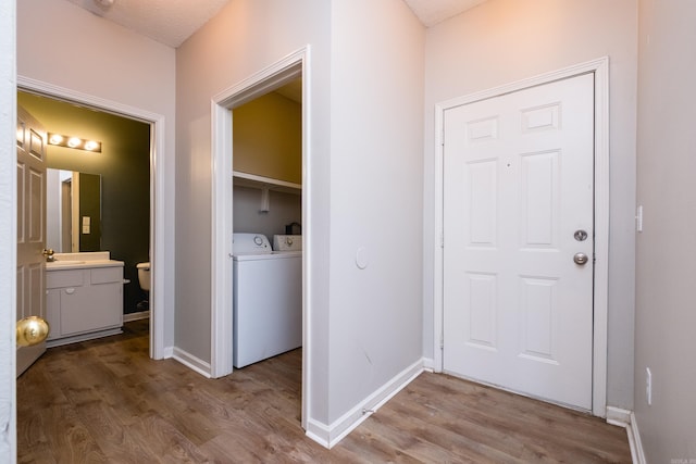 800 N St Unit 48, Little Rock, AR 72201 - washroom featuring wood finished floors and separate washer and dryer