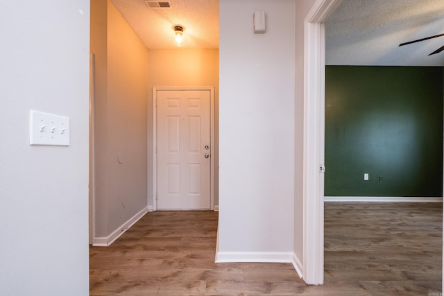 800 N St Unit 48, Little Rock, AR 72201 - hall featuring a textured ceiling and wood finished floors