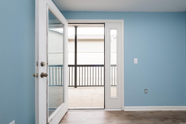 800 N St Unit 48, Little Rock, AR 72201 - doorway to outside with wood finished floors and baseboards