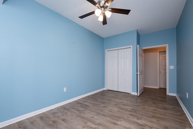 800 N St Unit 48, Little Rock, AR 72201 - unfurnished bedroom featuring wood finished floors, a closet, and a ceiling fan