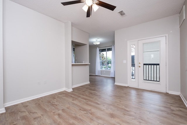 800 N St Unit 48, Little Rock, AR 72201 - unfurnished room featuring ceiling fan, light wood-style floors, and a textured ceiling