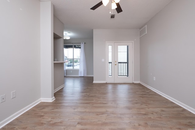800 N St Unit 48, Little Rock, AR 72201 - unfurnished room with a ceiling fan, wood finished floors, and a textured ceiling