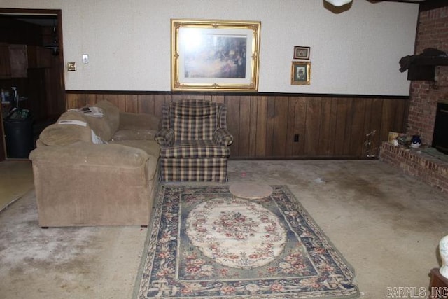 22213 N Springlake Rd, Hensley, AR 72065 - living room with wainscoting, a fireplace, and wooden walls