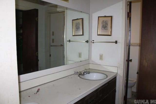 22213 N Springlake Rd, Hensley, AR 72065 - bathroom featuring toilet and vanity