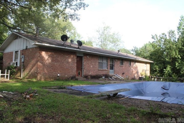 22213 N Springlake Rd, Hensley, AR 72065 - back of house featuring brick siding and a covered pool