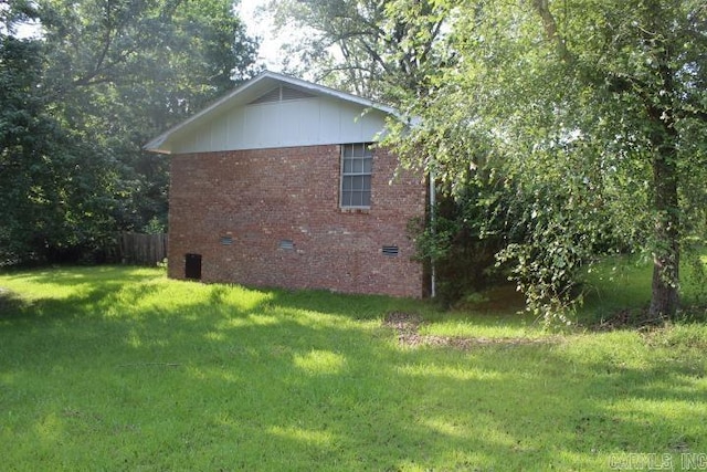 22213 N Springlake Rd, Hensley, AR 72065 - view of property exterior featuring a lawn, brick siding, and crawl space