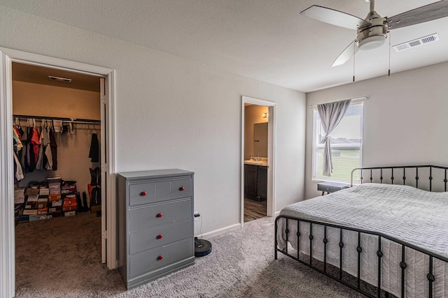 5244 Prospect Trl, Jonesboro, AR 72405 - carpeted bedroom featuring a spacious closet, a closet, ensuite bath, and a ceiling fan