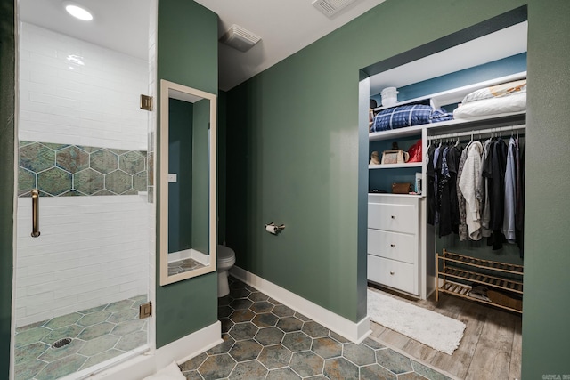 2709 Ottawa Dr, North Little Rock, AR 72116 - bathroom with a stall shower and a walk in closet