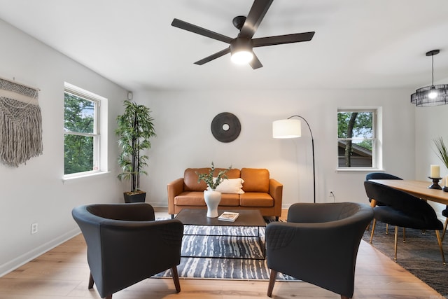 1112 N Hughes St, Little Rock, AR 72007 - living area with healthy amount of natural light, a ceiling fan, and light wood-style floors