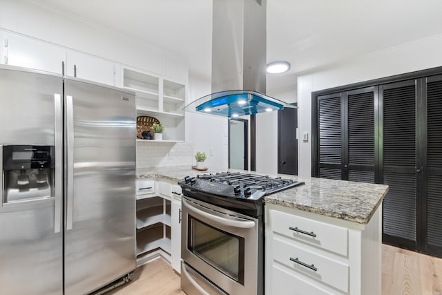 1112 N Hughes St, Little Rock, AR 72007 - kitchen with stainless steel appliances, island range hood, open shelves, a peninsula, and backsplash