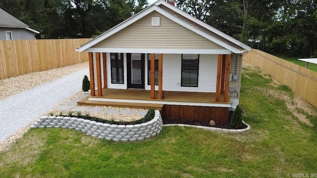 219 N Chestnut St, Harrison, AR 72601 - view of outbuilding with a fenced backyard and covered porch