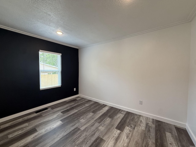 219 N Chestnut St, Harrison, AR 72601 - empty room with dark wood-style floors, crown molding, a textured ceiling, and recessed lighting