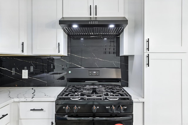 43 S Wakefield Dr, Little Rock, AR 72209 - kitchen featuring gas stove, premium range hood, tasteful backsplash, and white cabinetry