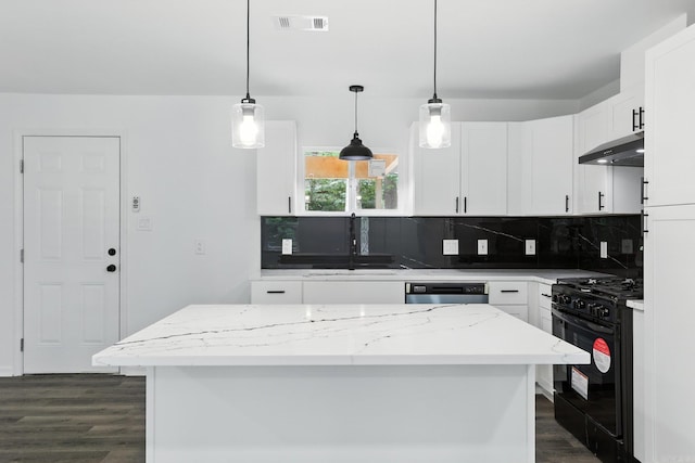 43 S Wakefield Dr, Little Rock, AR 72209 - kitchen featuring black gas range, under cabinet range hood, dark wood finished floors, decorative backsplash, and white cabinets