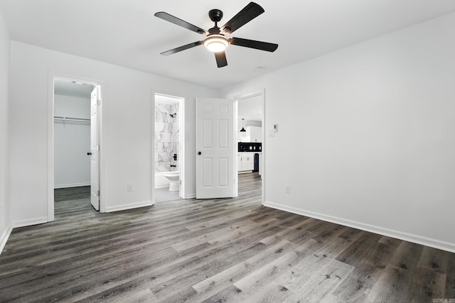 43 S Wakefield Dr, Little Rock, AR 72209 - unfurnished bedroom featuring a walk in closet, wood finished floors, a closet, ensuite bathroom, and ceiling fan