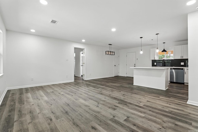 43 S Wakefield Dr, Little Rock, AR 72209 - unfurnished living room featuring recessed lighting, dark wood-style flooring, and a chandelier