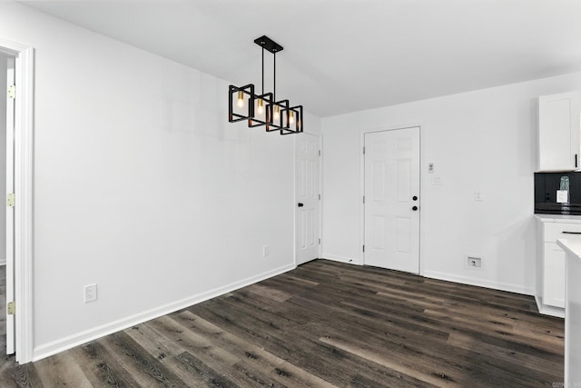 43 S Wakefield Dr, Little Rock, AR 72209 - unfurnished dining area featuring a chandelier and dark wood-type flooring