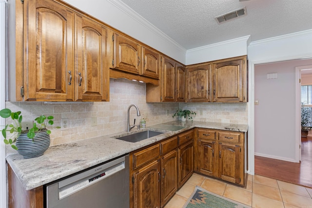2608 Grist Mill Rd, Little Rock, AR 72227 - kitchen with stainless steel dishwasher, brown cabinets, crown molding, tasteful backsplash, and a textured ceiling