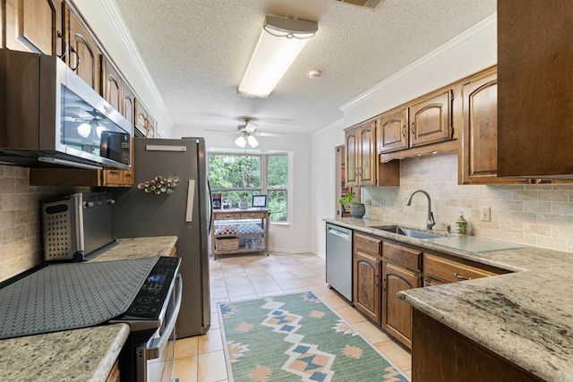 2608 Grist Mill Rd, Little Rock, AR 72227 - kitchen featuring stainless steel appliances, decorative backsplash, light tile patterned flooring, ceiling fan, and ornamental molding