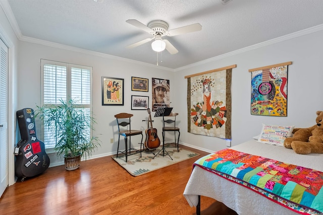 2608 Grist Mill Rd, Little Rock, AR 72227 - bedroom featuring wood finished floors, ornamental molding, a textured ceiling, and a ceiling fan