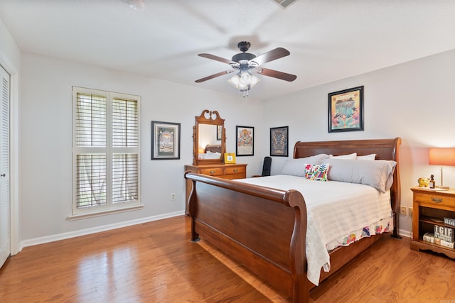 2608 Grist Mill Rd, Little Rock, AR 72227 - bedroom with wood finished floors and a ceiling fan