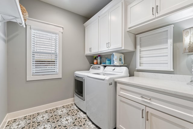 2690 Overcup Dr, Conway, AR 72034 - laundry room featuring washing machine and dryer, cabinet space, and light tile patterned flooring