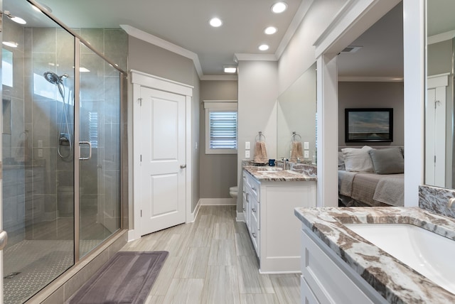 2690 Overcup Dr, Conway, AR 72034 - ensuite bathroom featuring two vanities, ornamental molding, a shower stall, and recessed lighting