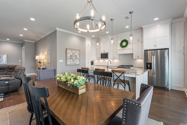 2690 Overcup Dr, Conway, AR 72034 - dining area featuring dark wood-type flooring, a chandelier, recessed lighting, and ornamental molding