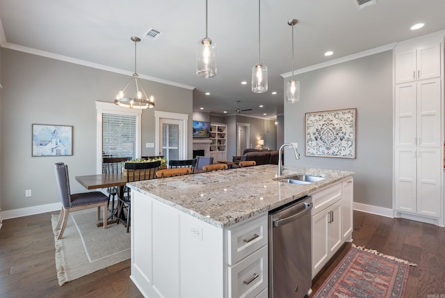 2690 Overcup Dr, Conway, AR 72034 - kitchen with stainless steel dishwasher, ornamental molding, dark wood-type flooring, white cabinets, and decorative light fixtures