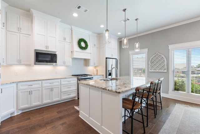 2690 Overcup Dr, Conway, AR 72034 - kitchen featuring appliances with stainless steel finishes, dark wood-type flooring, decorative backsplash, white cabinetry, and ornamental molding