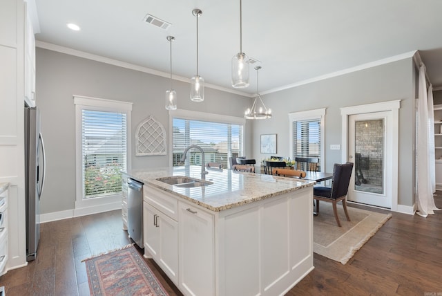 2690 Overcup Dr, Conway, AR 72034 - kitchen featuring appliances with stainless steel finishes, white cabinets, crown molding, dark wood finished floors, and light stone counters