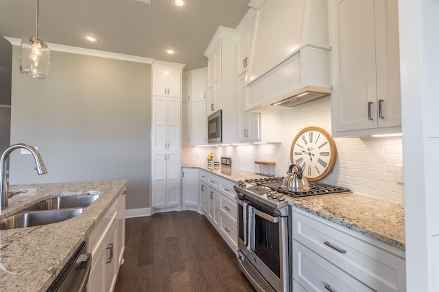 2690 Overcup Dr, Conway, AR 72034 - kitchen with appliances with stainless steel finishes, dark wood-style flooring, backsplash, white cabinetry, and recessed lighting