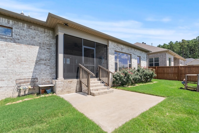 2690 Overcup Dr, Conway, AR 72034 - view of yard featuring a sunroom, entry steps, and a patio