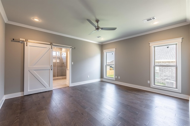 2690 Overcup Dr, Conway, AR 72034 - unfurnished bedroom with a barn door, dark wood-style floors, ornamental molding, ensuite bathroom, and recessed lighting