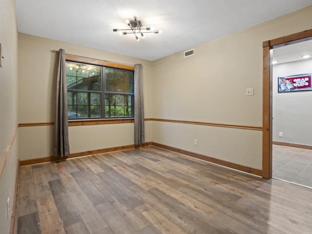 16 Almenara, Hot Springs Village, AR 71909 - empty room featuring wood finished floors and baseboards