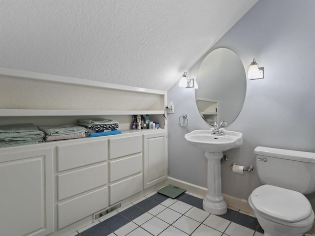 16 Almenara, Hot Springs Village, AR 71909 - bathroom with a textured ceiling, vaulted ceiling, and tile patterned floors